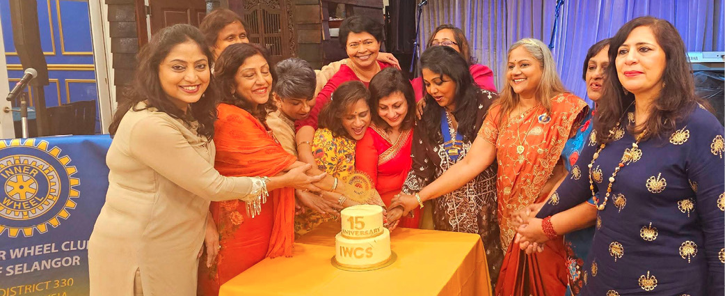 A group of women are gathered around a table with a cake on it. They are cutting the cake and smiling.

AI generated content