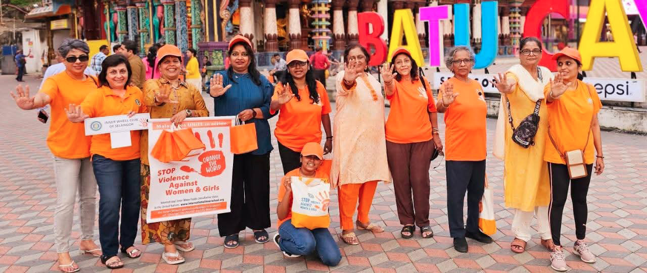 A group of people wearing orange shirts and holding up signs.
AI generated content