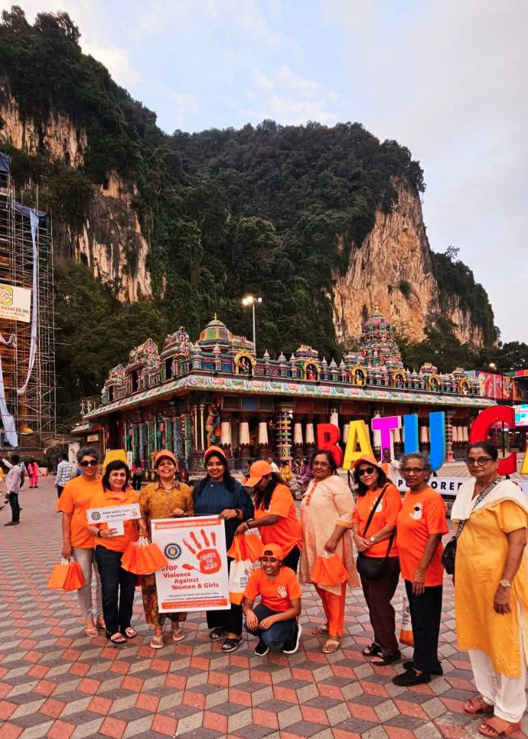 A group of people are standing on a red brick walkway in front of a temple.
AI generated content