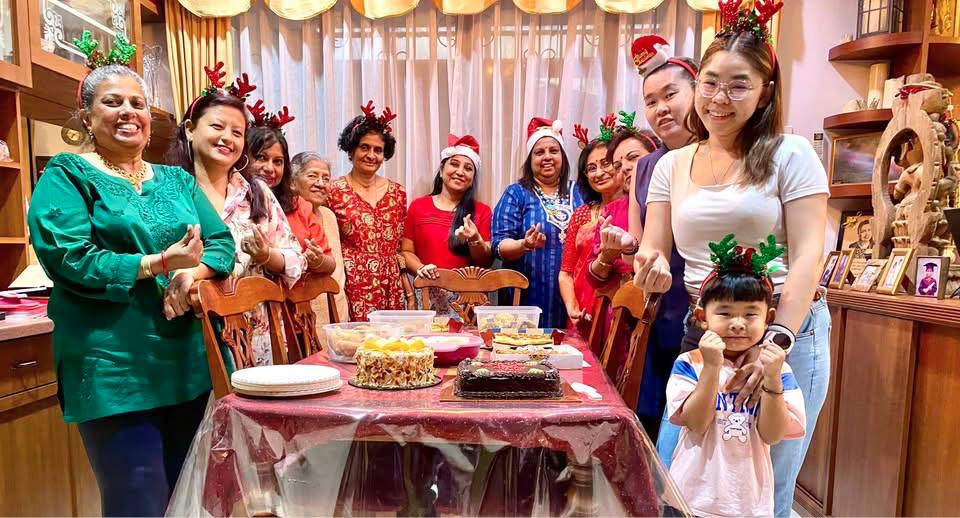 A group of people, including children, pose for a picture in a room with a dining table and chairs.

AI generated content