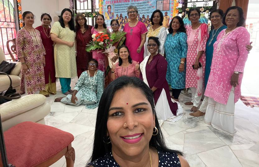 A group of women posing for a picture, with one woman taking a selfie.
AI generated content