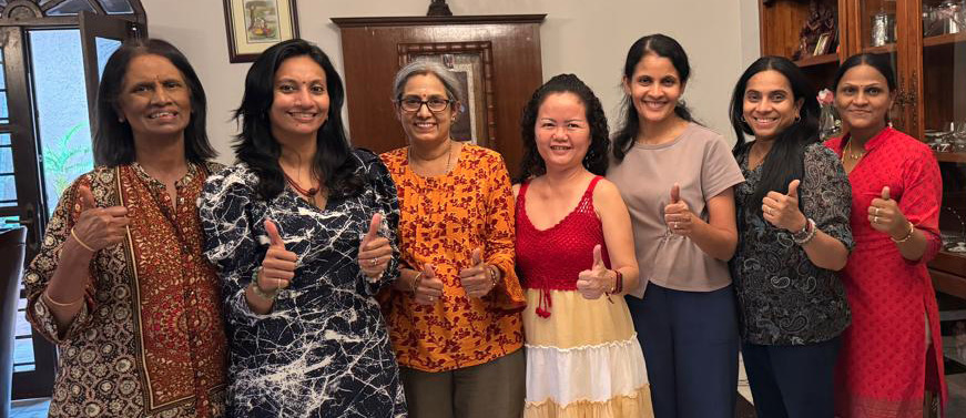 A group of women posing for a picture, some wearing dresses and others in casual clothing.

AI generated content