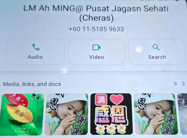 A phone screen shows a contact named "LM Ah MING@ Pusat Jagaan Sehati (Cheras)" with options for audio, video, and search, along with a row of thumbnail images featuring a child and colorful graphics.
Description generated by AI
