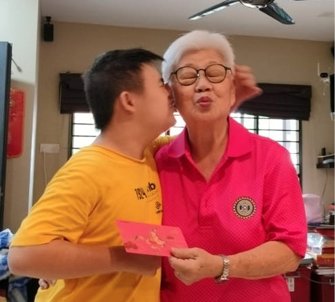 A woman in a pink shirt and a boy in a yellow shirt are kissing each other on the cheek.

AI generated content