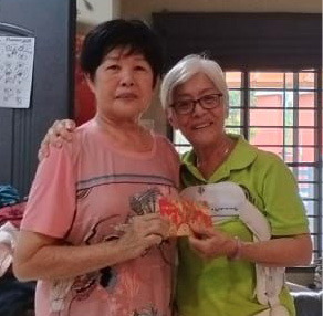 Two women standing in a living room, one holding a cell phone.

AI generated content