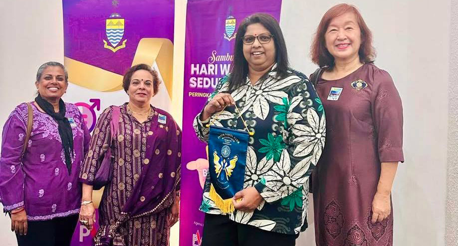 Four women pose for a picture in front of a sign.
AI generated content