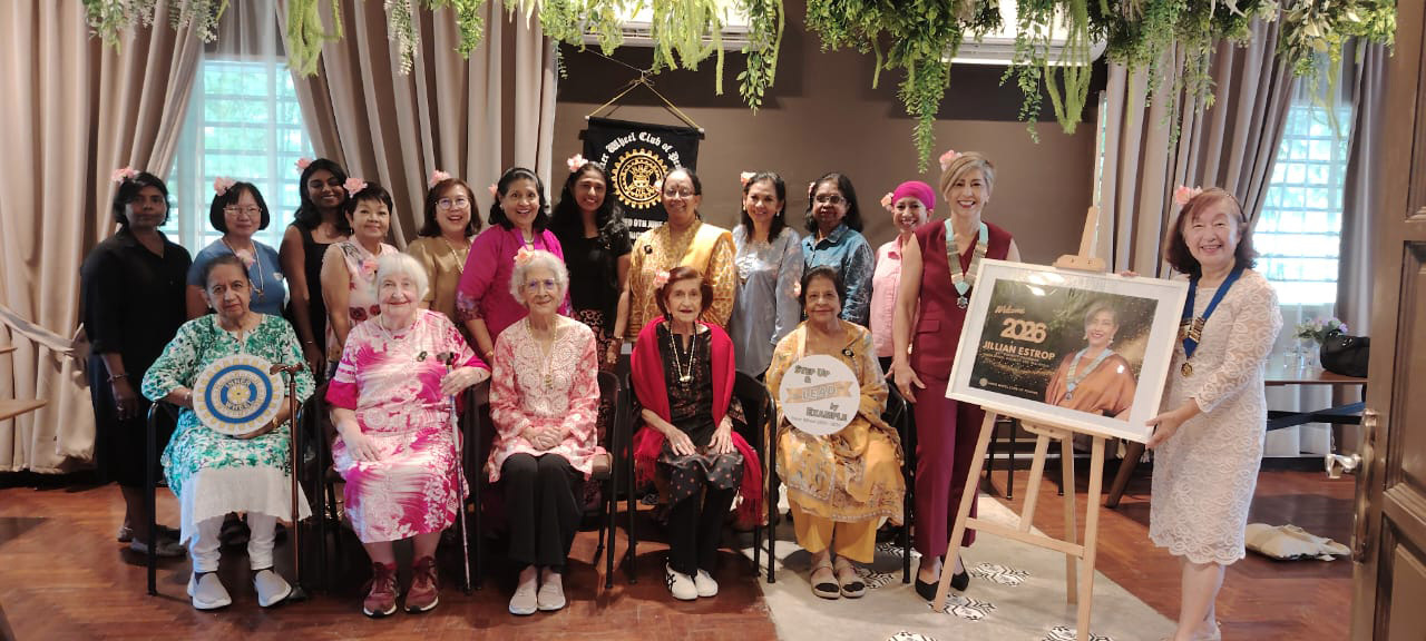 A group of women are sitting in a room, posing for a picture. They are wearing colorful outfits and some are holding cell phones.

AI generated content