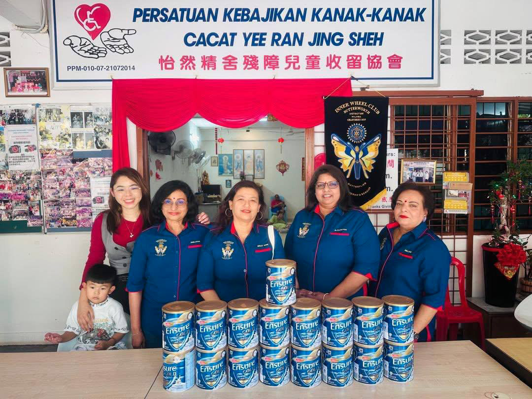 Four women are standing in front of a table full of canned food.

AI generated content