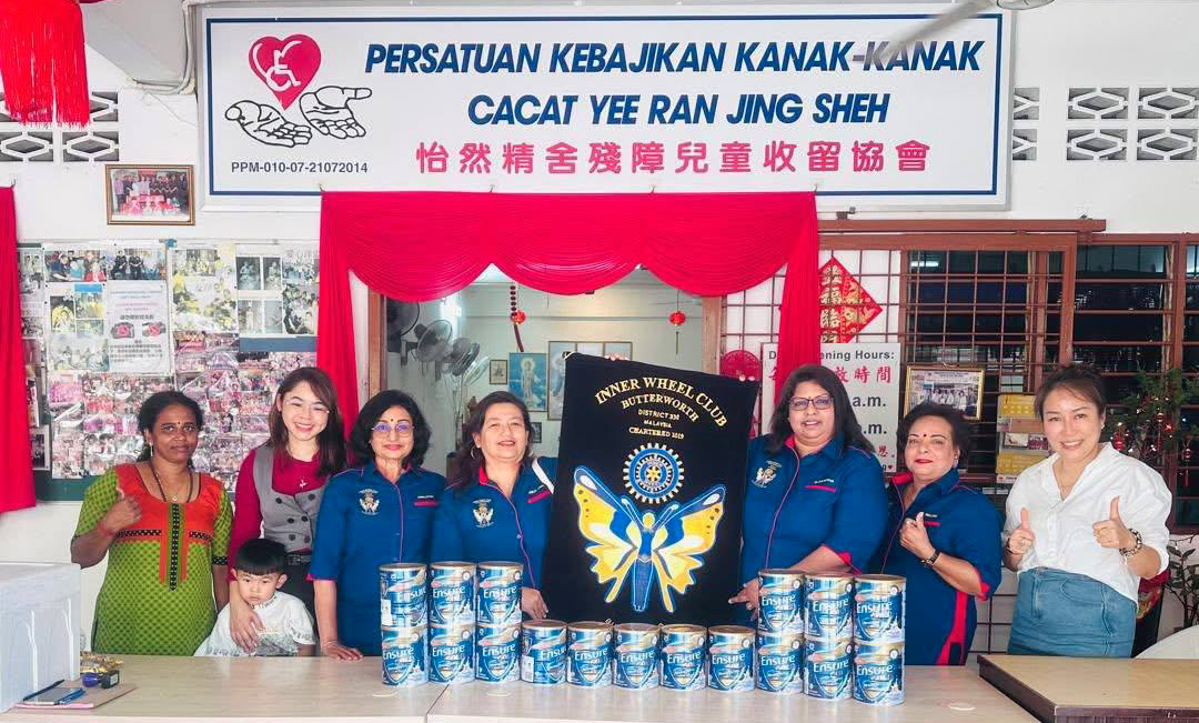 A group of women are standing in front of a table with a large sign.
AI generated content
