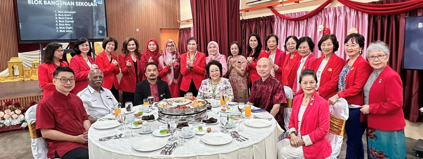 A group of people wearing red jackets are sitting around a table with plates of food.

AI generated content