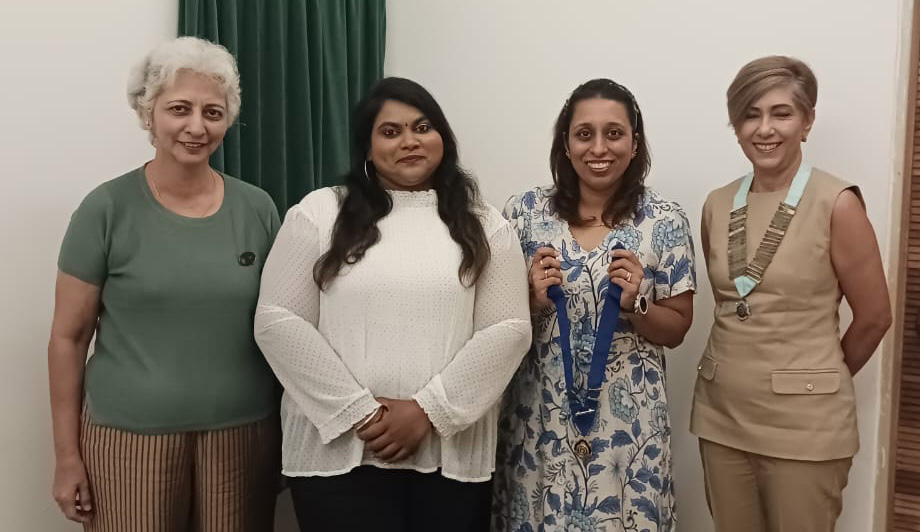 Four women pose for a picture, two of them holding medals.
AI generated content